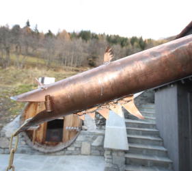 The roofer exercising his artistic skills with guttering at Ste Foy chalet renovation