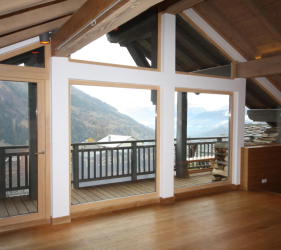 New windows installed at Ste Foy chalet renovation looking west