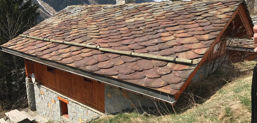 Courchevel chalet roof replacement showing a traditional stone roof