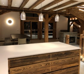 Ste Foy chalet construction contrast wood and white walls, white corian worksurface